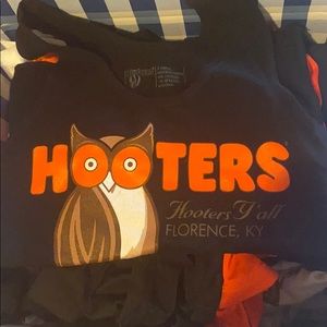 Box of Used Hooters uniforms